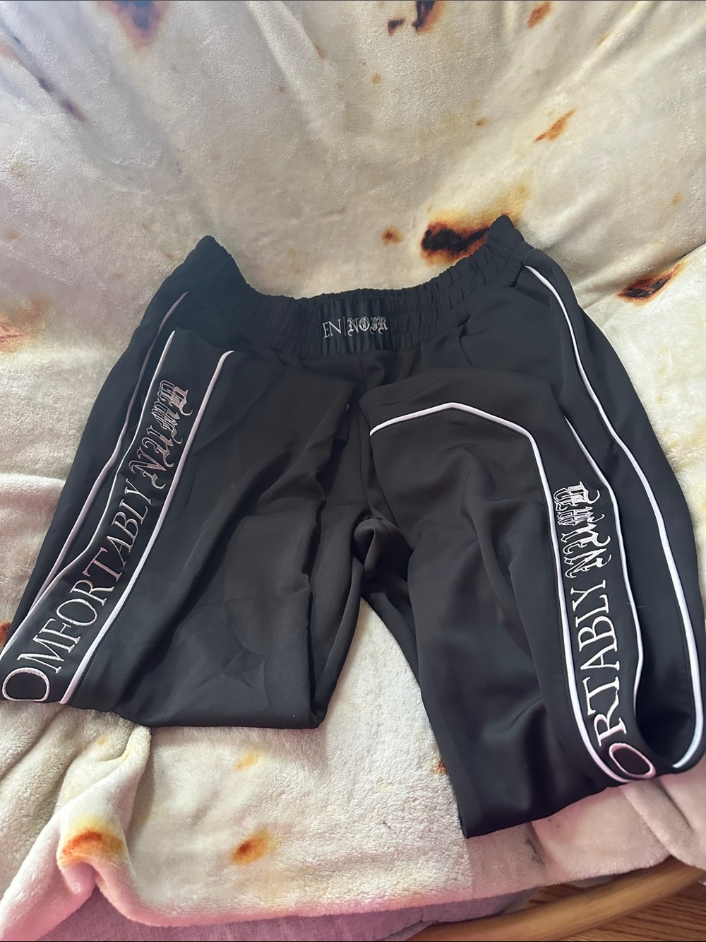 nOir Jewelry Black Sweatpants with White Piping and Pink Accent Script